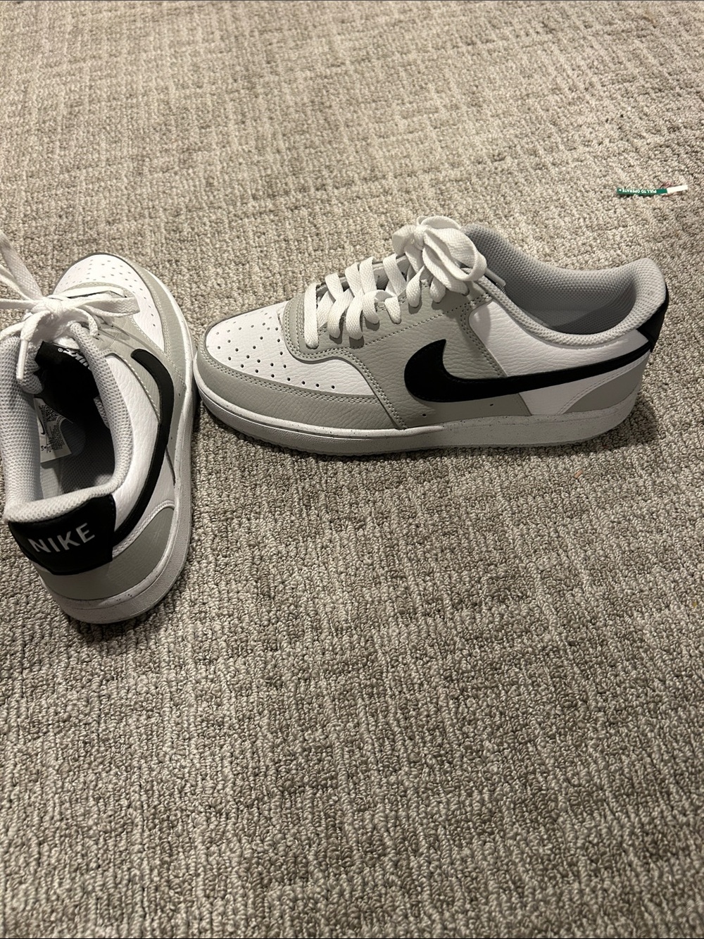 Nike Men’s White and Black Low-Top Sneakers with Black Swoosh